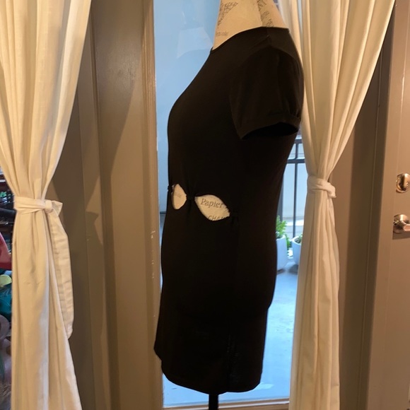 Small black shortsleeve dress with cut outs and knots at stomach waist level​ - Picture 5 of 8